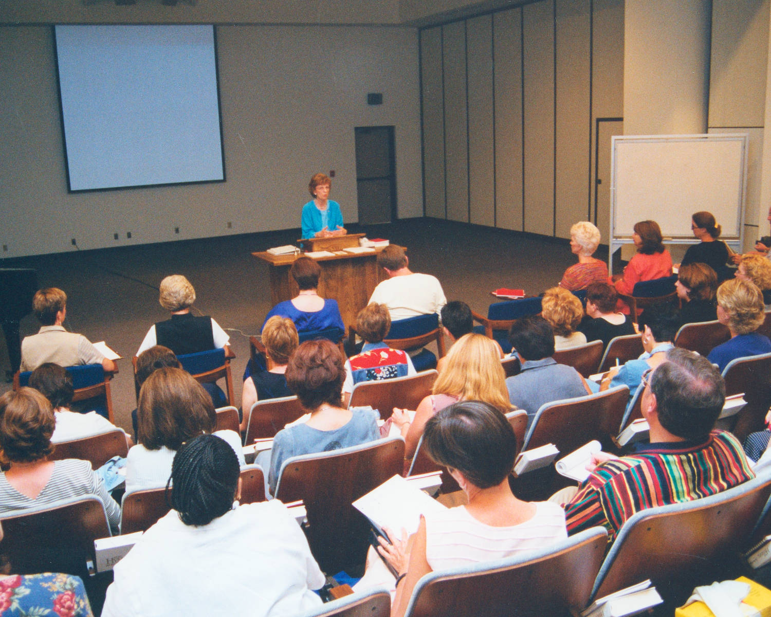 2000-Jean-Nystrand-Speaking-at-Headquarters-Auditorium-1.jpg